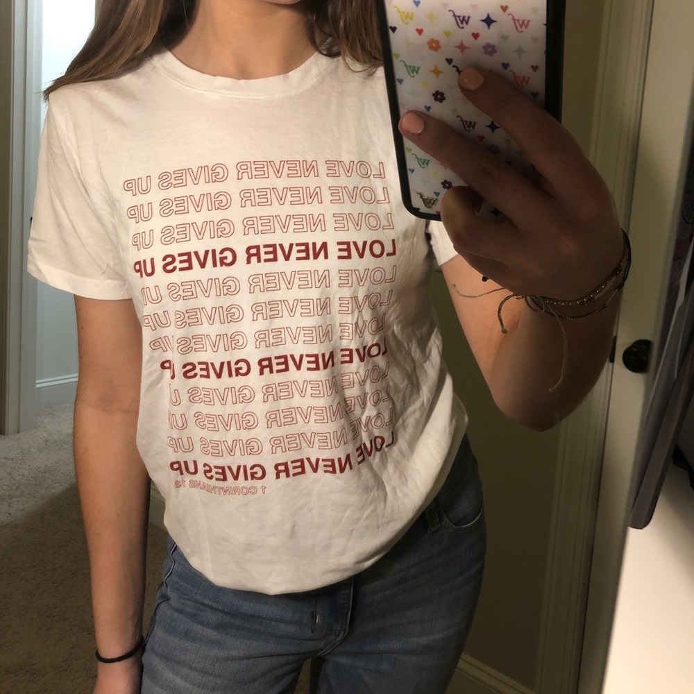 love never gives up tee